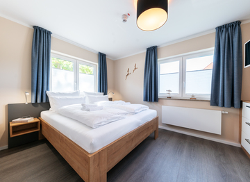 Eines der gemütlichen Schlafzimmer in unseren Apartments